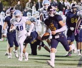 Jefferson running back Braedan Cummings carries the ball towards the end zone for a touchdown in the first quarter. Cummings scored another rushing touchdown in the fourth quarter.
