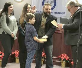 Franklin Councilman Concetto Formica is sworn in to a new term by state Sen. Steven Oroho, right, during the annual reorganization meeting Sunday, Jan. 1. Standing with him are his wife, Bobbi, and children AnnaMaria and Vincenzo. (Photos by Kathy Shwiff)