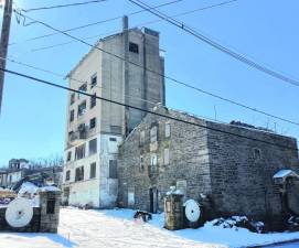 The 1924 concrete mill, including the 90-foot tower/grain silo, on Gingerbread Castle Road just off Route 23 in Hamburg is being demolished. The owner also began demolition of the shorter office tower - without permission. A stop-work order was issued until it is determined what can be saved, stabilized and how. (Photo provided)