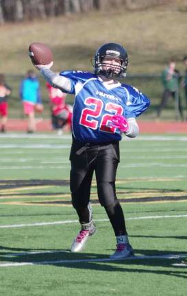 Blue All-Stars quarterback C.J. Brunner in throw motion during the Super PeeWees game. Brunner plays for the Wallkill Valley Junior Rangers.