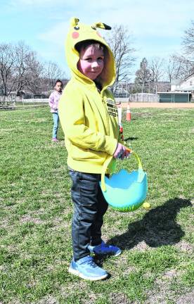 Wyatt Kays of Ogdensburg looks up from hunting Easter eggs.