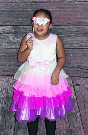 Teolis Reyes looks through a mask.