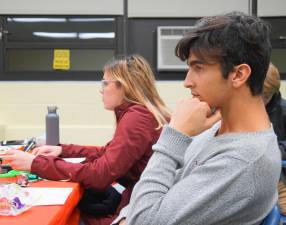 PHOTO BY VERA OLINSKI From left, Becka Terzakis and Michael Catli attend the Vernon Coalition meeting.