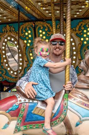<b>A young fair-goer on the merry-go-round Saturday, Aug. 2. (Photo by Nancy Madacsi)</b>