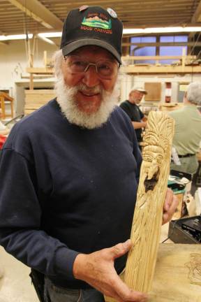 Photos by Gale Miko Henry Hanzo with one of his creations.