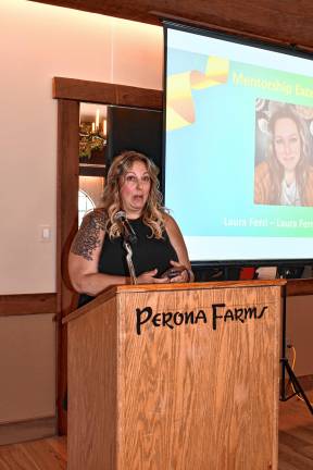WO3 Laurie Ferri of Laura Ferri Growth Co. receives the Mentorship Excellence Award.