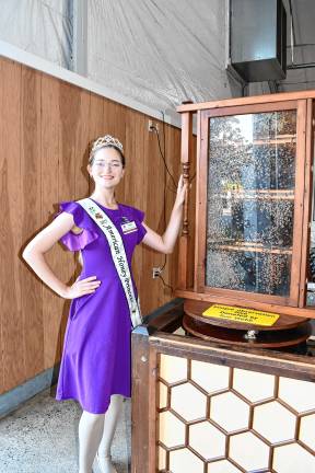 <b>Emilia Burnham, the 2025 American Honey Princess, by the Honeybee Demo on Sunday, Aug. 3. (Photo by Maria Kovic)</b>