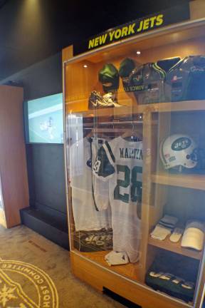 A Curtis Martin N.Y. Jets jersey is shown inside the trailer.