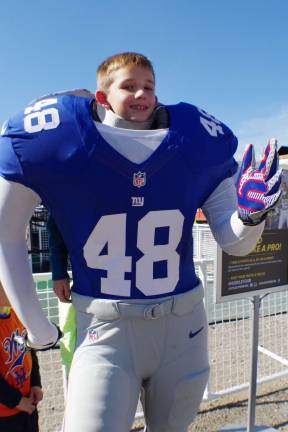 Ryan Dobrzynski, 8, of Vernon poses as a member of the New York Giants. The number 48 stands for the Super Bowl XLVII, which will be held at MetLife Stadium in East Rutherford in February 2014.