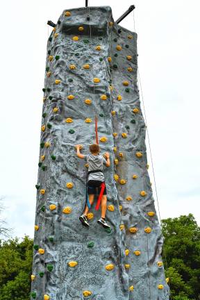 Leo Restrepo of Hamburg climbs a rock wall at Hamburg Day on Sunday, Aug. 24. (Photos by Maria Kovic)