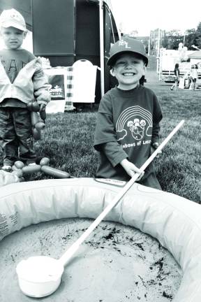 Kaegan Murphy of Stillwater trying to catch mosquitos.
