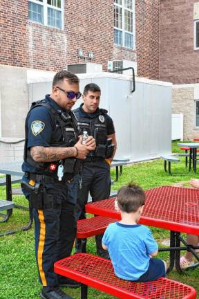 Hamburg police officers talk to students during an ‘Ice Cream with the Cops’ event Thursday, Aug. 29 at Hamburg School. (Photos by Maria Kovic)