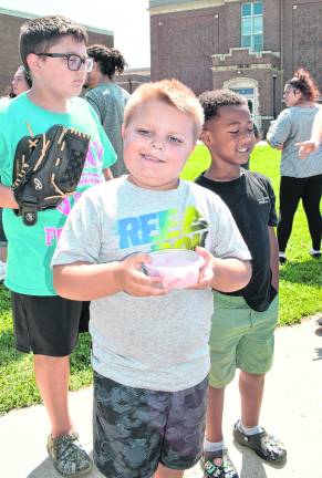 Colton Ross of Franklin holds his ice cream.