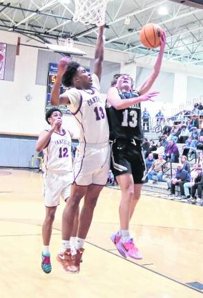 Wallkill Valley's Alex Opilla is met in the air by Passaic Charter's defender Luis Gabriel during a shot in the second half. Gabriel blocked the shot but Opilla scored 23 points in the game.