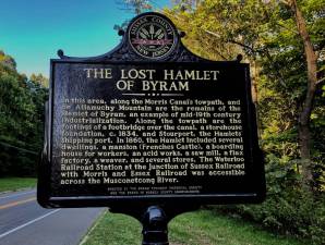 A historical marker for the Lost Hamlet of Byram was erected last fall at the Morris Canal Greenway trailhead on Waterloo Road, just northeast of the Morris County line. It disappeared by Dec. 15 after it reportedly was knocked down by a vehicle. (Photo courtesy of Byram Township Historical Society/Frank Gonzalez))
