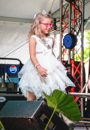 <b>Little Miss Newton Allena Crowell is interviewed during the Little Royalty presentation Tuesday, Aug. 5. (Photo by Nancy Madacsi)</b>