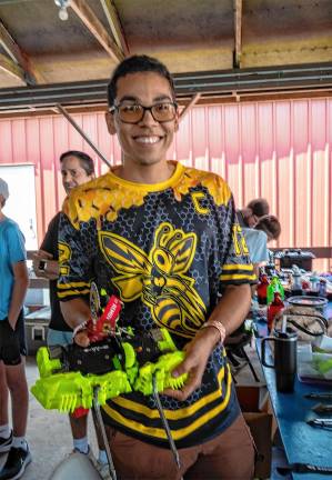 <b>Mark Young with his robot Sting Operation on Saturday, Aug. 2. (Photo by Nancy Madacsi)</b>.