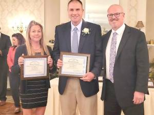 Educator of the Year winners Kasey Kervatt and Josh Bennett, with Hardyston Chief School Administrator Mike Ryder.