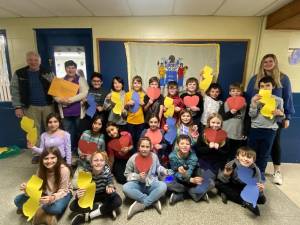 Sussex County historian Bill Truran, left, poses with fourth-graders taught by Holly Romahn, second from left, at Hardyston Elementary School. The class wrote letters to legislators, urging that Franklinite be named New Jersey’s official mineral. (Photo provided)