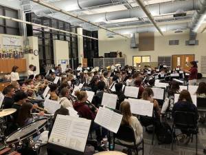 <b>Lucille Kincaid leads the 89-member All-Sussex County Chorus at Sparta High School.</b>
