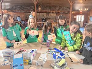 Girl Scouts make first-aid kits during the first Girl Scout First Aid and Safety Award event March 8 in Andover Township. (Photos provided)
