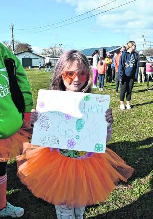 <b>Emma Hells of Hardyston cheers on her sister and the Hardyston team.</b>