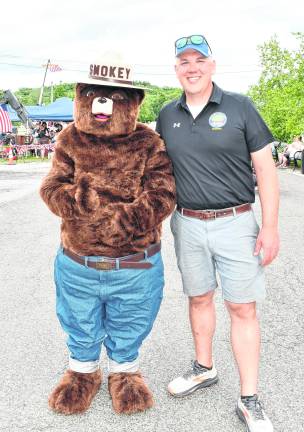 <b>Matt Sinke of Sussex County Engineering poses with Smokey.</b>