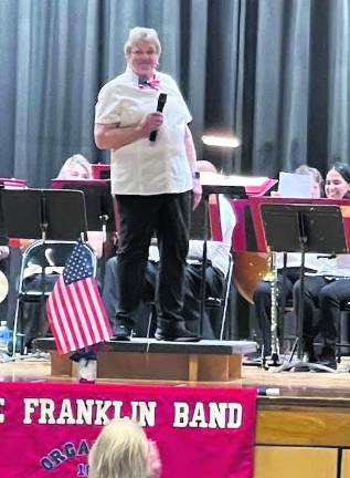 Conductor Judy Bobiak speaks at the Franklin Band's spring concert.
