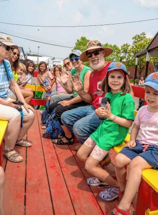 <b>Fair-goers on the tractor ride Tuesday, Aug. 5. (Photo by Nancy Madacsi)</b>