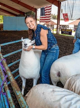 <b>Becky Aron and her award-winning Cheviot sheep Saturday, Aug. 2. (Photo by Nancy Madacsi)</b>