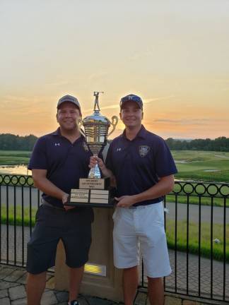 Port Authority Police Officers Joe Della Serra and Geoff Jeppson hold the championship trophy.