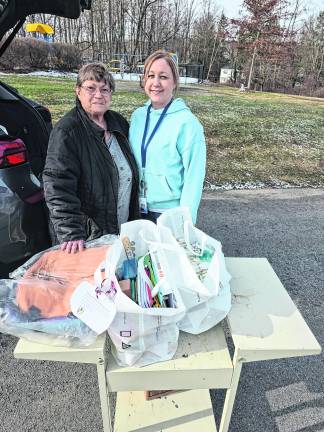 <b>Pictured during the presentation are Carolyn King, a Rotary member, and Sue Andriola of Ogdensburg Elementary School.</b>