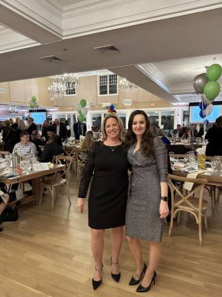 Chamber president Tammie Horsfield, left, presented an award to Lidia Zdunek, outgoing chairwoman of the chamber’s board of trustees, during the annual dinner.