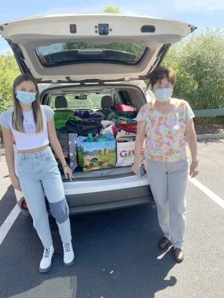 Ali Stoner (left) with her grandmother, Lois Pellow, and some of the supplies they gathered (Photo provided)