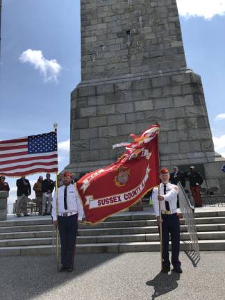 The American and Sussex County flags are presented during a Salute to Veterans ceremony Sunday, May 21 at the High Point Monument. (Photo by Kathy Shwiff)