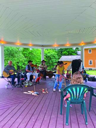 The Long Hill String Band entertains visitors in the gazebo at Waterloo Village in Stanhope.