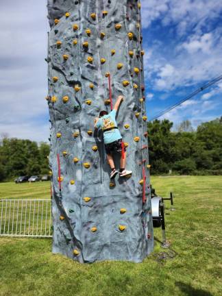 Nicholas Ramos, 9, of Hamburg climbs the rock wall.
