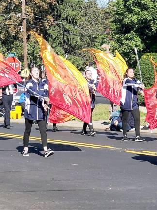 Flags are waived in unison.