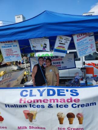 At the Clyde’s truck from Garfield, owner Valerie Martined poses with staffer Katarina Kovacs.