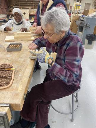 Agatha Sherin carves during a recent meeting.