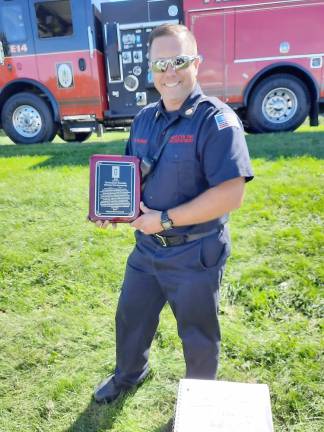 Hardyston Fire Chief Rob Washer with award from the mayor and council (Photo by Laura J. Marchese)