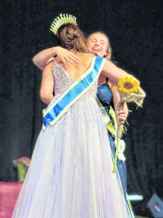 <b>2025 Queen Sophie Schaeffner congratulates the new NJ Fair Queen, Miss Sandyston, Jordan Valleau.</b>