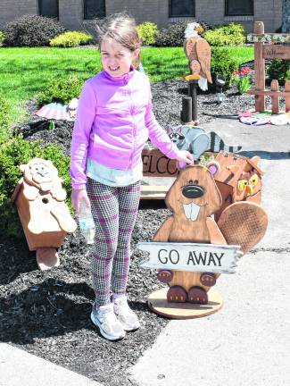 Kate Jovanovic of Sparta stands in front of a sign.