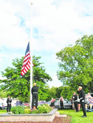 <b>Veterans from the Ogdensburg VFW raised the flag.</b>