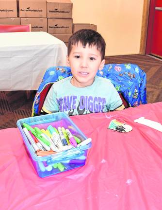 Domenic Card of Jefferson poses in front his art project.