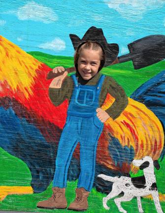 <b>Charlotte Hewitt poses for a photo in a cutout Saturday, Aug. 2. (Photo by Nancy Madacsi)</b>