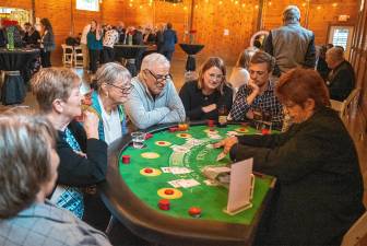 <b>Guests play blackjack at the Casino Night fundraiser for Family Promise of Sussex County. (Photos by Nancy Madacsi)</b>