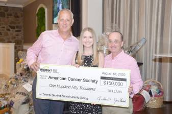 Weichert Insurance Agency President John Mahoney and Joe McDonald, regional vice president of Weichert Realtors and chairperson of Weichert’s 22nd Annual Charity Outing, present a check for $150,000 to Katelyn French, senior corporate relations manager for the American Cancer Society.
