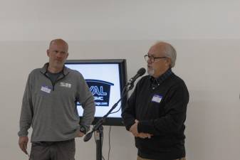 Dr. J.P. Bonnet speaks as Servant’s Heart Minisitry Executive Director John Oostdyk listens.