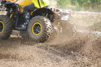 An example of an off-road vehicle riding in the mud.